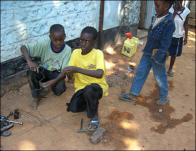 Friday's children and friends creating a wire toy car.