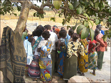 Troy takes down names for one of the microfinance groups.