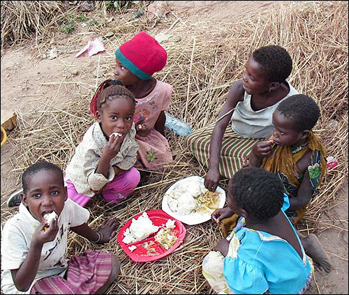 The kids enjoying their food.