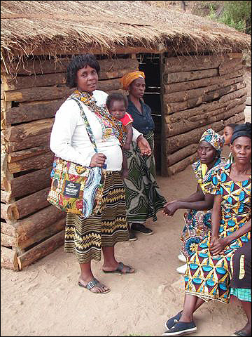 Georgina (left) sporting the chitenge bag she just completed.