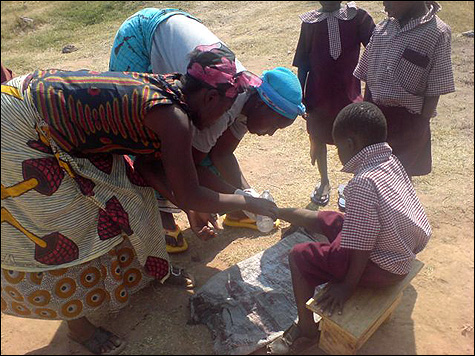 The Living Compassion women take over the medical treatment.