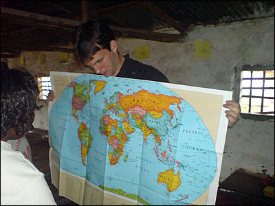 Tom showing a world map in the adult class.