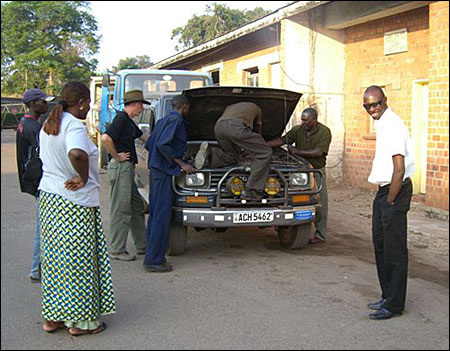 Diagnosing at the mechanics shop. Steve, our engineer, on the far right.