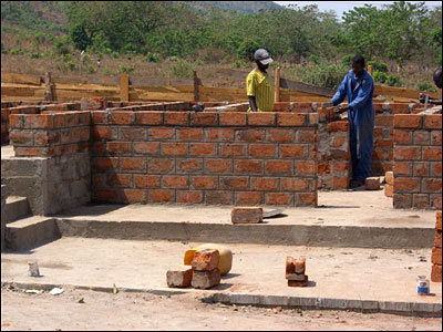 The men laying the bricks.