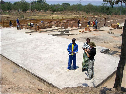 James, Theresa and Dave surveying the part of the building that will house the medical clinic.