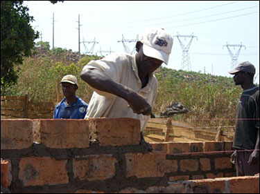 Laying the bricks.