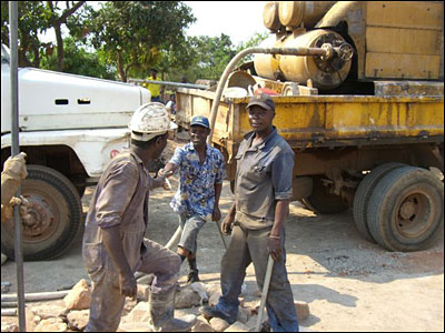 The workers sinking the pump.