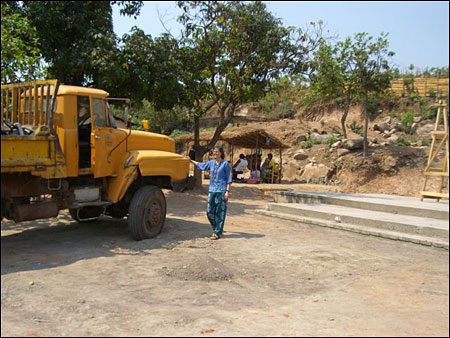 Jen greets the arrival of the truck.