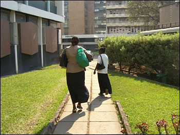 Theresa and Regina walking to the pension office.