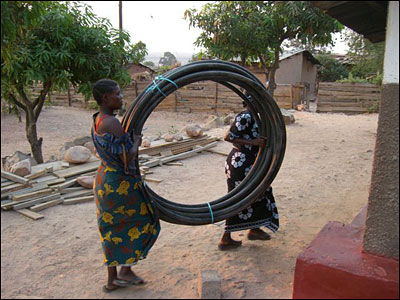 The Living Compassion women helping unload the well parts.