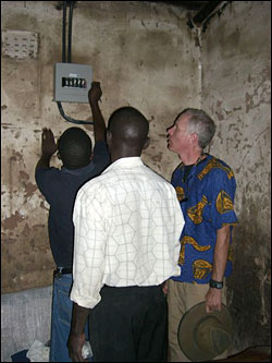 Dave showing where the pump will be hooked to electricity.