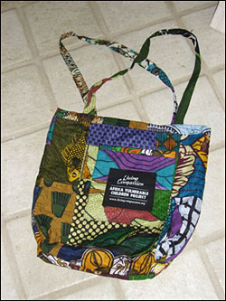 A handmade Living Compassion tote bag.