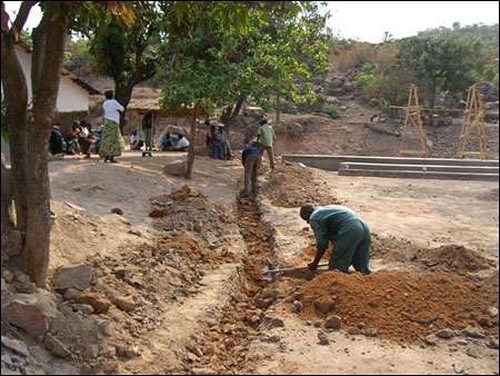 Digging trenches for the pipes.