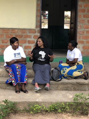 Theresa, Sreedevi and Memory discuss the possibilities of the Girls Program.