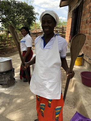 Charity bringing up the giant paddles used to stir 