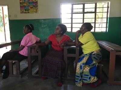 Memory and Malila, two of our teachers, observe and assist the girls.