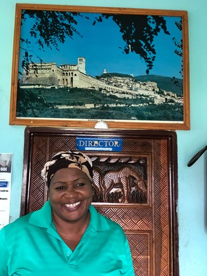 A full circle moment. Above the Director’s office door, a picture of Assisi, where it all started.