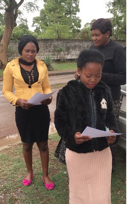 Girls reading their letters (they weren’t quite sure yet what they were)